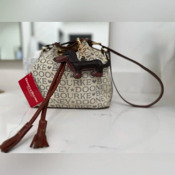 Dooney & Bourke Ivory and Brown Bucket Bag with Dachshund Leather Charm